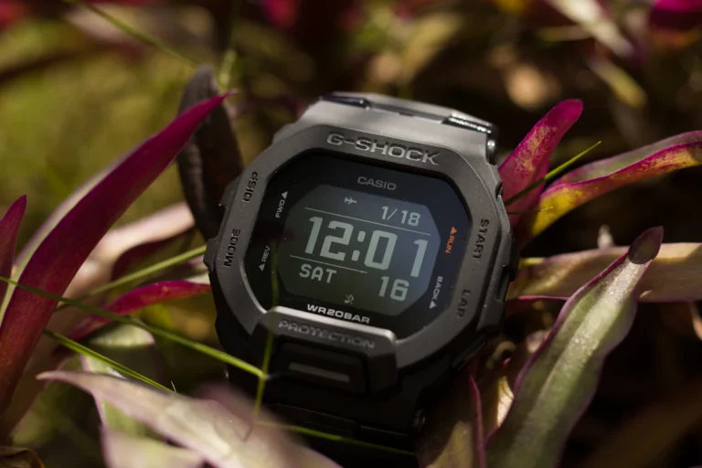 Digital watch among green plants